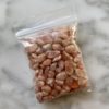 a bag of mini sunstone gemstone chips
