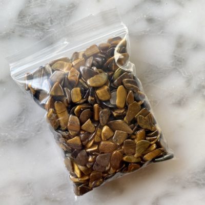 a bag of mini tiger eye gemstone chips