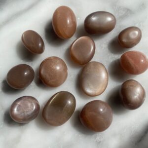 peach moonstone tumbled pocket stone