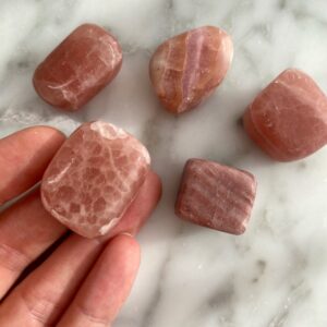 large pink calcite tumbled pocket stone